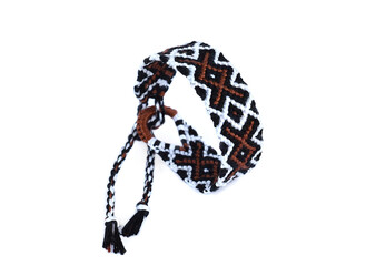 Woven DIY friendship bracelet handmade of embroidery bright thread with knots on white background.