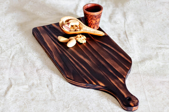 braxil nuts in a cutting board. nuts in a cutting board,