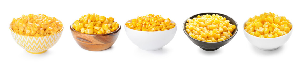 Bowls with fresh corn seeds on white background
