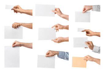 Human hands with blank sheets of paper on white background