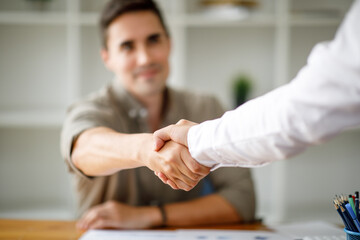 Business man offer and give hand for handshake in office. Successful job interview. Apply for loan...