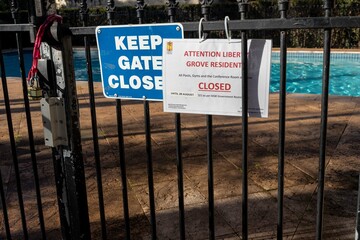 Sydney/NSW/Australia 09142021. 
Pool closed because of covid-19. Keep the gate closed. 