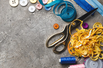 Composition with sewing supplies on grunge background
