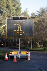 Street roads traffic warning sign. Wear mask, Help stop the spread, play equipment closed,...