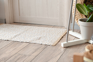 Stylish rug on floor in interior of modern hallway
