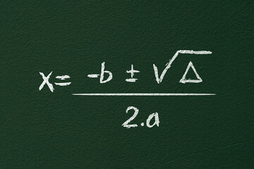 Formula of bhaskara. illustration of high school equation written in chalk on blackboard. mathematical operation. x is equal to b plus or minus the square root of delta over 2 a. - obrazy, fototapety, plakaty