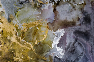 Golden and Siver Waves. Abstract Alcohol ink. Trendy wallpaper. Natural pattern. Abstract artwork. Modern fluid art. Luminous, free-flowing. Luxurious background