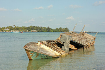 Shipwreck fishing boat on the beach in Indonesia