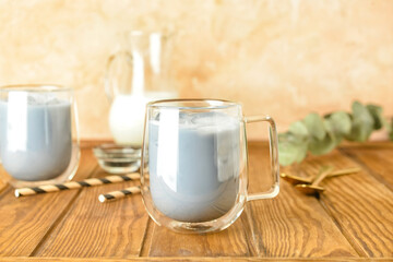 Glass cup of tasty Charcoal Latte on table