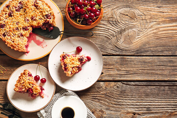 Composition with tasty cherry pie and cup of coffee on wooden background