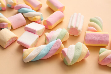 Tasty marshmallows on color background