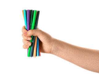 Woman holding colorful felt tip pens on white background