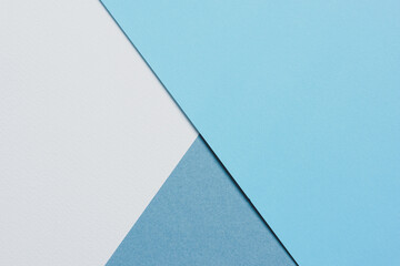 abstract background concept with geometric shapes of blank white paper and two colour of blue paper.