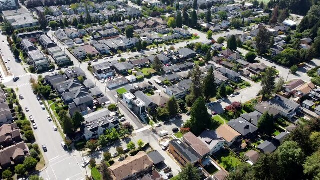 Aerial video of North Vancouver, BC residential houses on a beautiful sunny day.