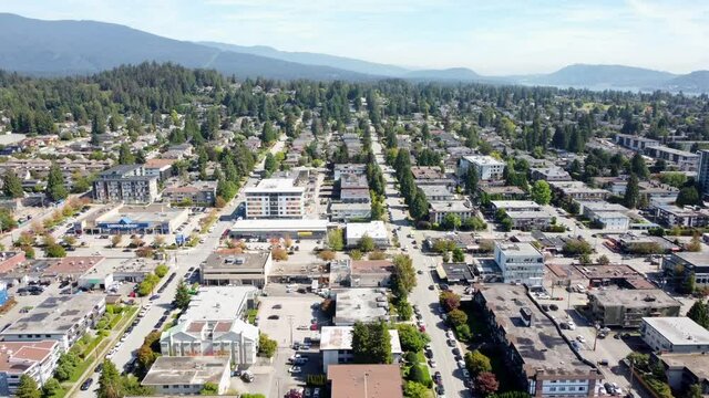 Aerial video of North Vancouver, British Columbia residential houses on a beautiful sunny day.