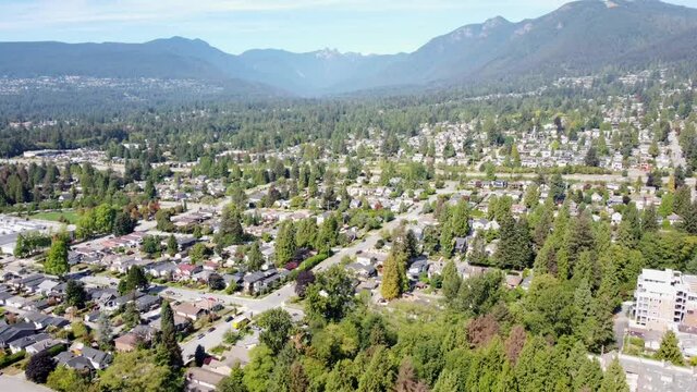 Aerial video of North Vancouver, British Columbia residential houses on a beautiful sunny day.