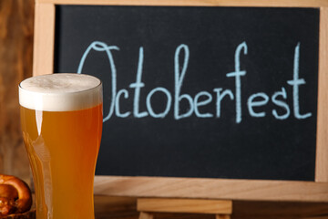 Glass of fresh beer on table, closeup. Oktoberfest celebration
