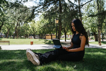 Girl working online from a park