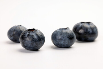 Fresh ripe deep purple Blueberry on white background macro closeup