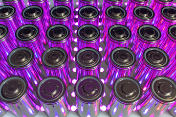 A pack of new modern high-capacity lithium-ion cells. A prototype of new batteries on a laboratory table with UV light.