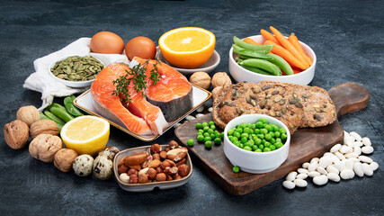 Food high in vitamin B1 on dark background.