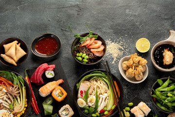 Fototapeta na wymiar Japanese dishes and snacks on gray background.