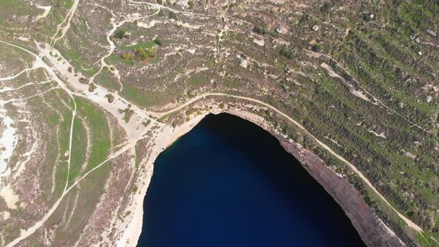 Amazing drone video from west of Malta, Dingli, Ras id-Dawwara, flying over the bay with crystal clear water.