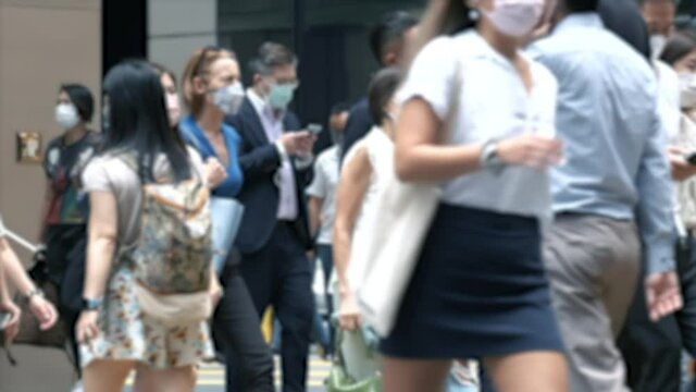 Unidentified crowd of people wearing medical face mask. Coronavirus concept.