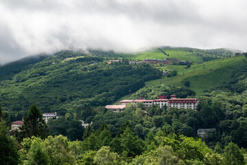 A resort area on a Japanese plateau half-covered with clouds