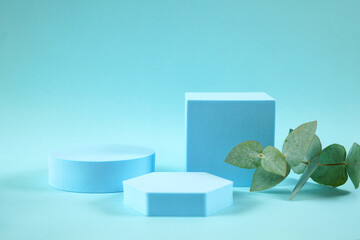 Cosmetic Product Stand Podium Mockup background in blue styled setting.