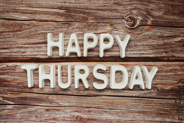 Happy Thursday text message on wooden background