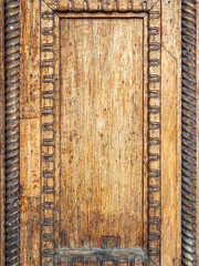Fragment of wooden door of old building of the 19th century.