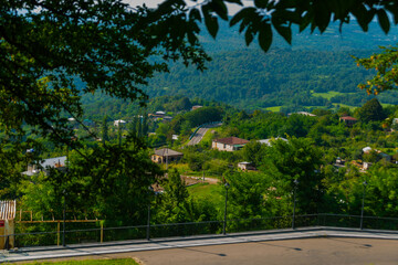 KUTAISI, GEORGIA: Beautiful landscape with views of the hills and mountains in Gelati Monastery on a sunny summer day.