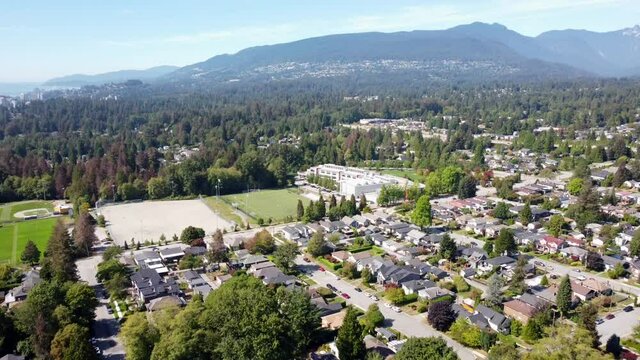 Aerial video of North Vancouver, British Columbia residential area on a beautiful sunny day.