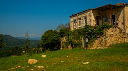 KUTAISI, GEORGIA: Landscape with a view of the Gelati Monastery on a sunny summer day in the background of the blue sky.