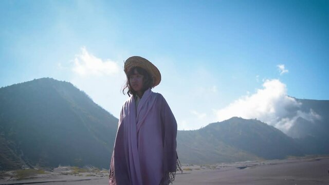 A young asian teenager tourist in the mountains