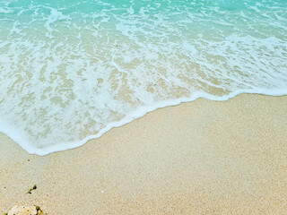 Soft blue waves on a clean sandy beach. travel photos