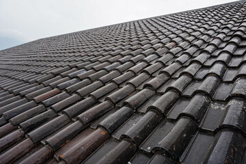 Fototapeta premium Black roof of the house tile arrangement