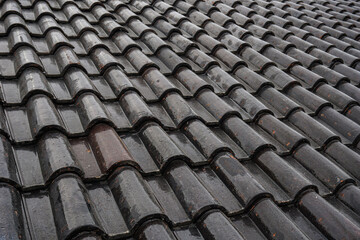 Black roof of the house tile arrangement