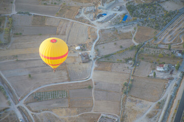 Balloon in the sky with people in Cappadocia