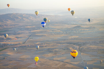 Balloon in the sky with people in Cappadocia