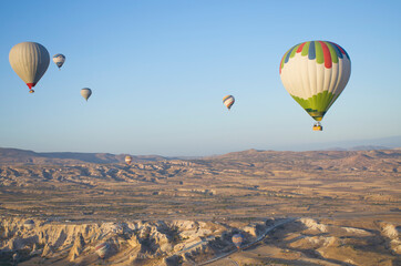 Balloon in the sky with people in Cappadocia