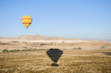 Balloon in the sky with people in Cappadocia