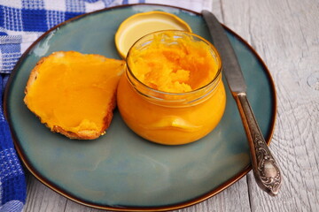 Homemade pumpkin butter in glass jar made with organic pumpkins