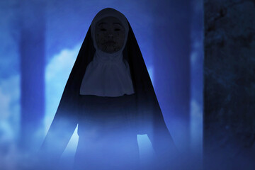 Scary devil nun standing in the abandoned building