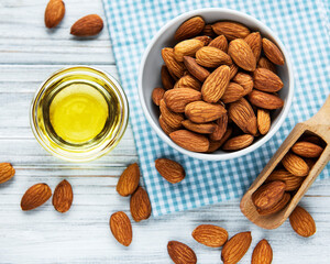 Almond oil and bowl of almonds