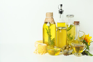 Set of different oils on white background