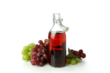 Bottle of vinegar and grape isolated on white background