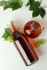 Concept of grape vinegar on white background