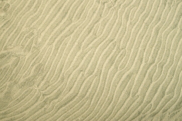 Beautiful wavy beach sand close up
